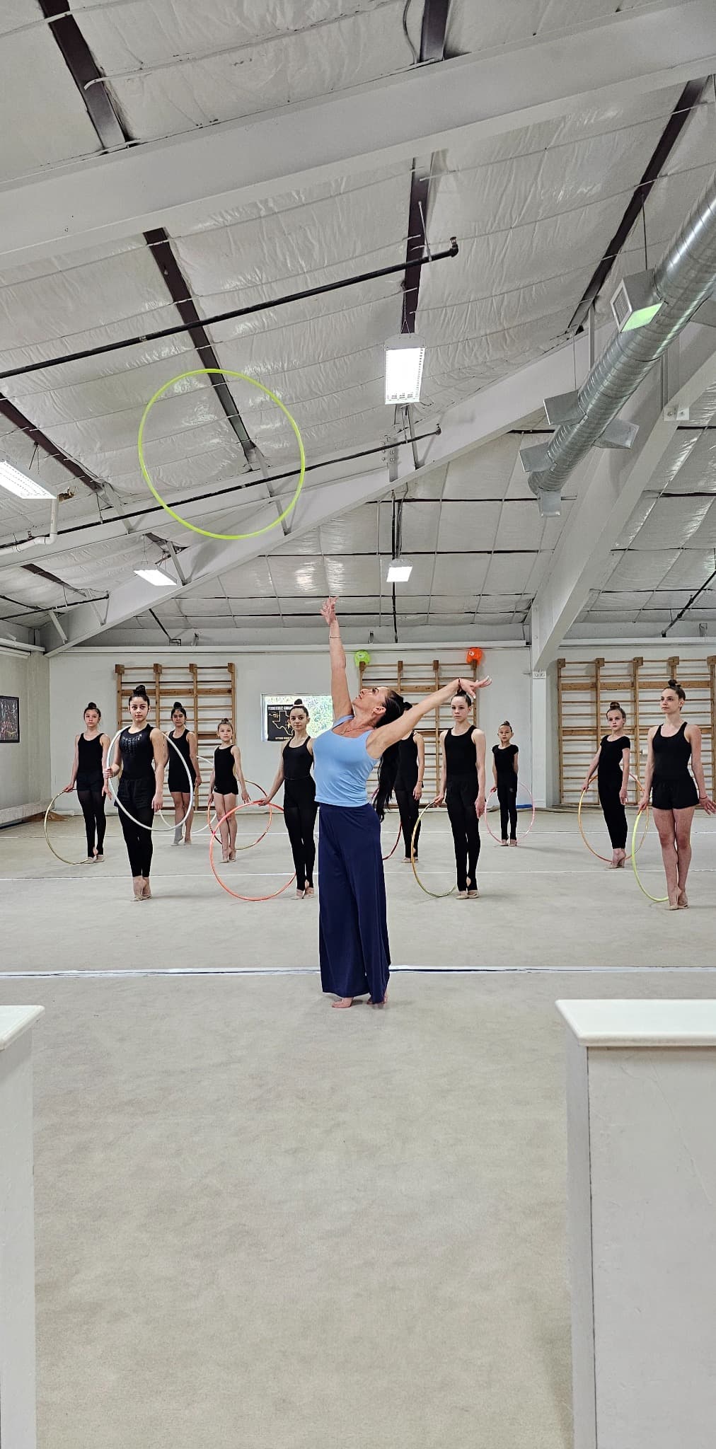 Coach Ella demonstrating hoop throw