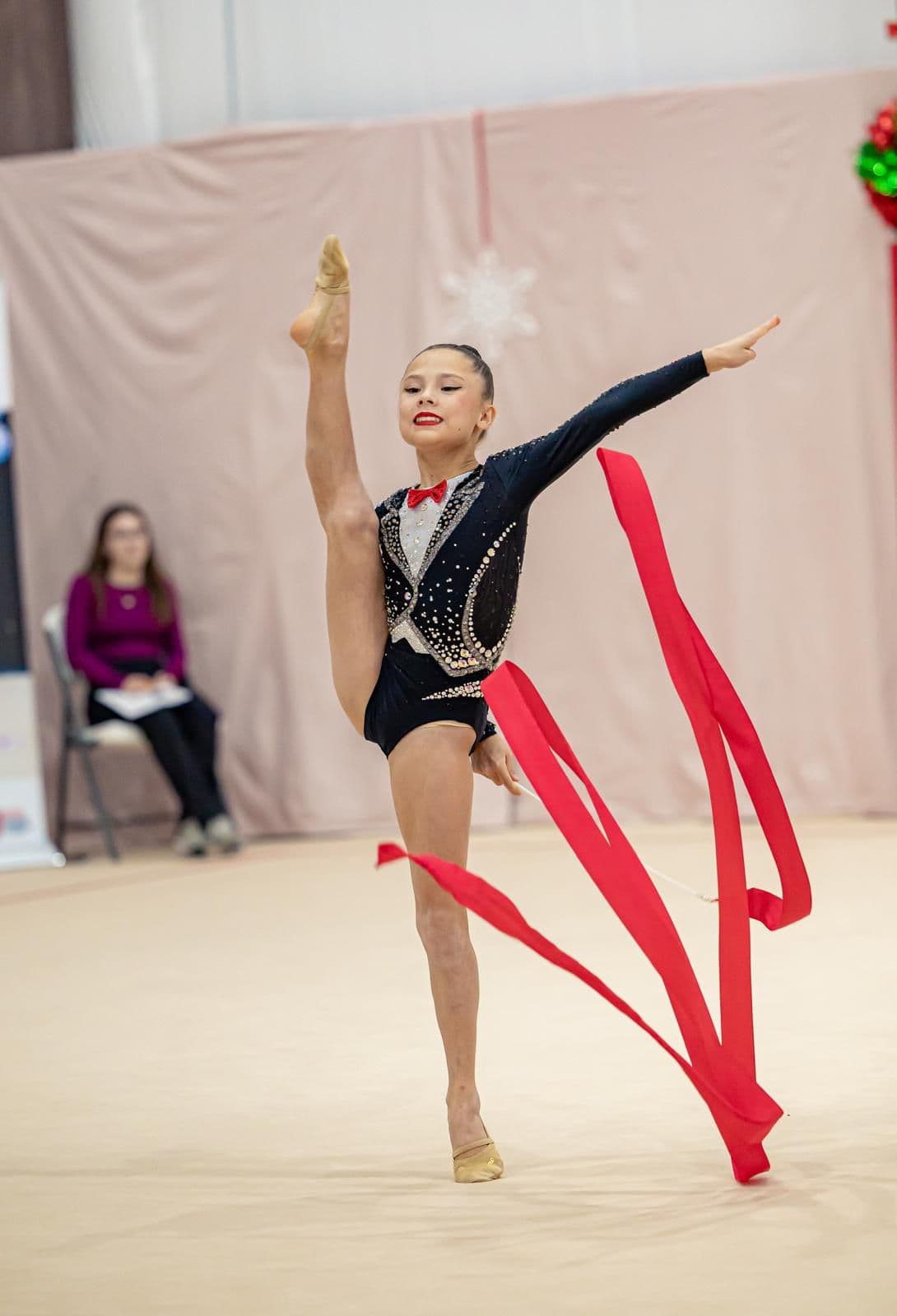 Student performing ribbon routine at competition