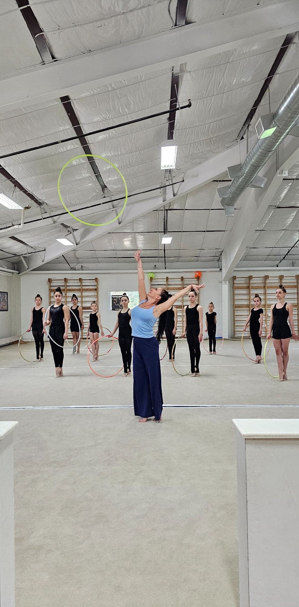 Coach Ella demonstrating hoop throw