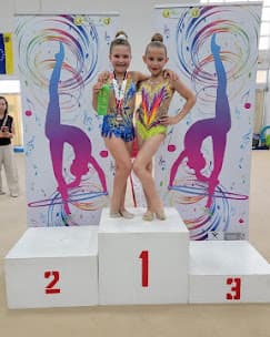 Two gymnasts on competition podium
