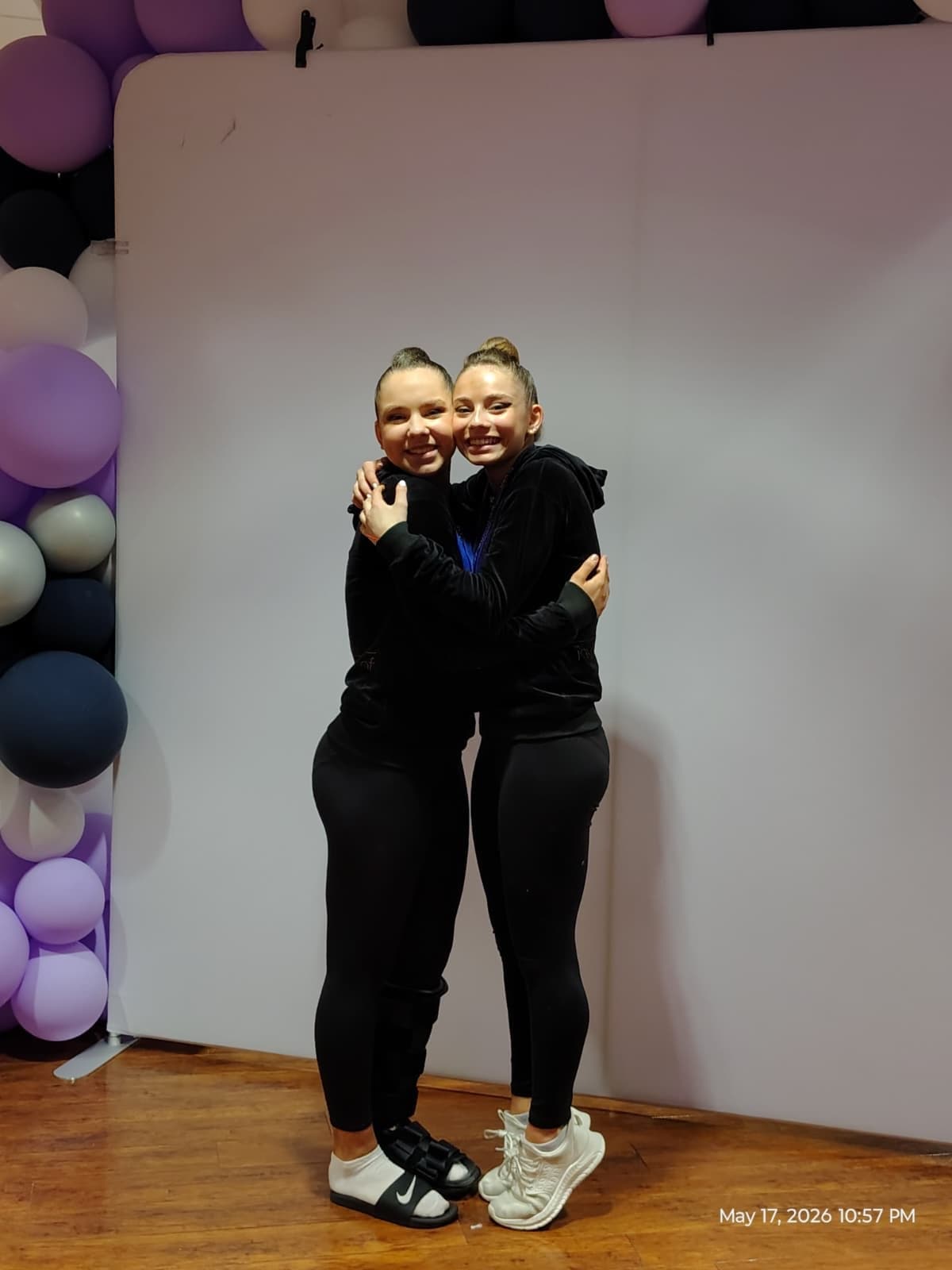 RRT teammates celebrating cheek to cheek after the 2026 USAG Rhythmic Elite Qualifier