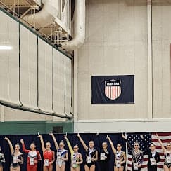 Team salute under USA banner
