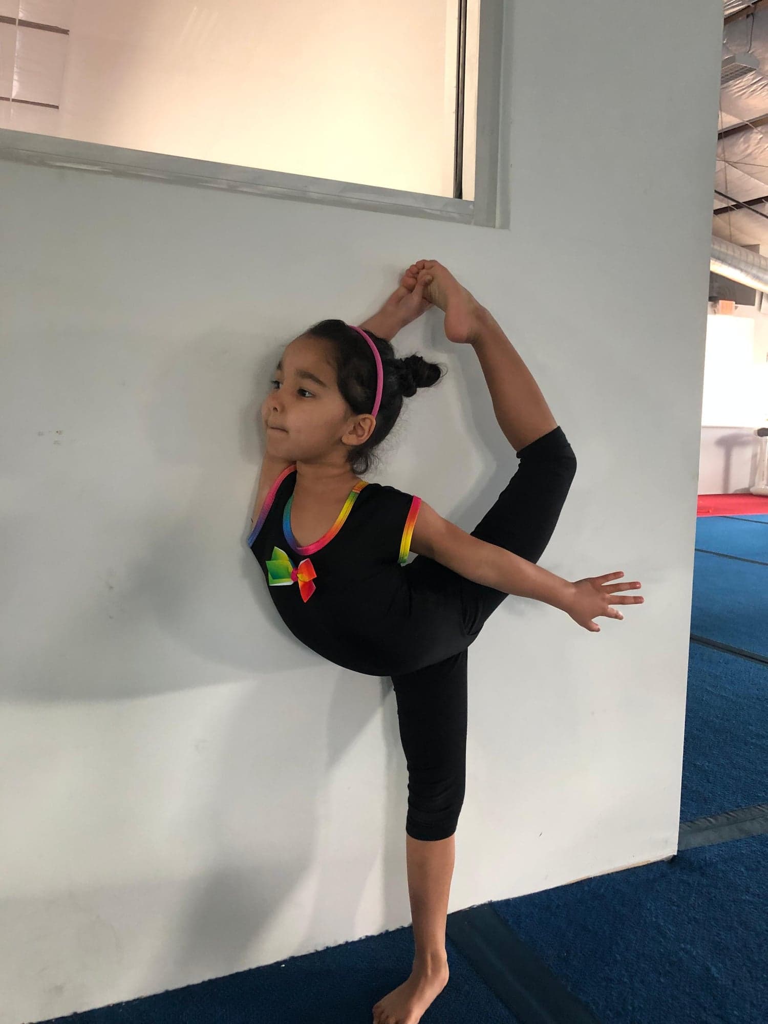 Young student practicing wall balance